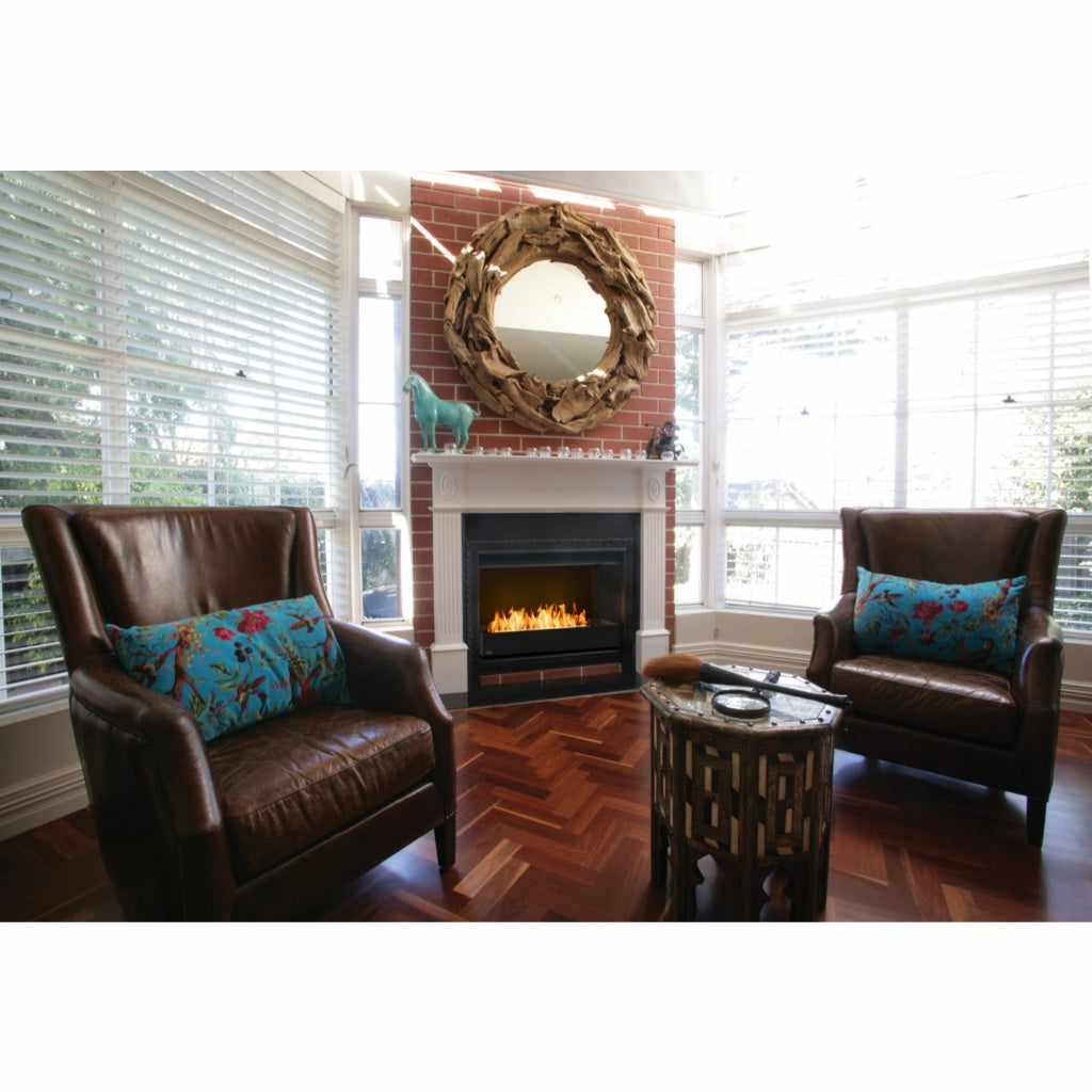 EcoSmart Fire Grate 30 installed in a black fireplace insert within a red brick chimney breast in a living room.
