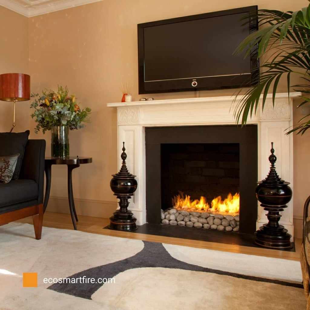 EcoSmart Fire Grate 30 fireplace with a burning flame, grey stone base, and white mantel in a living room setting.