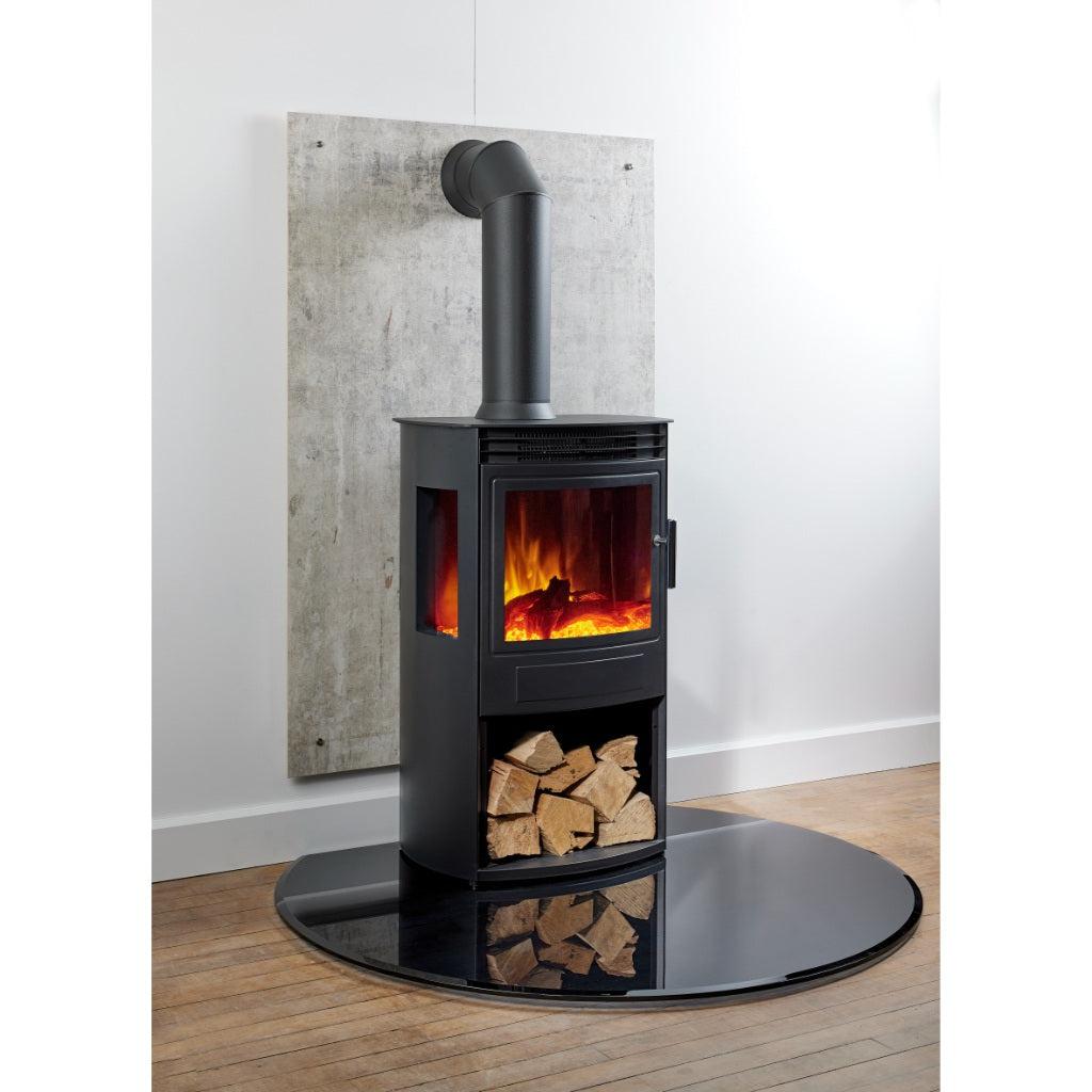 Flametek Alto T3 panoramic electric stove in black with a log storage base, flue pipe, and circular glass hearth.