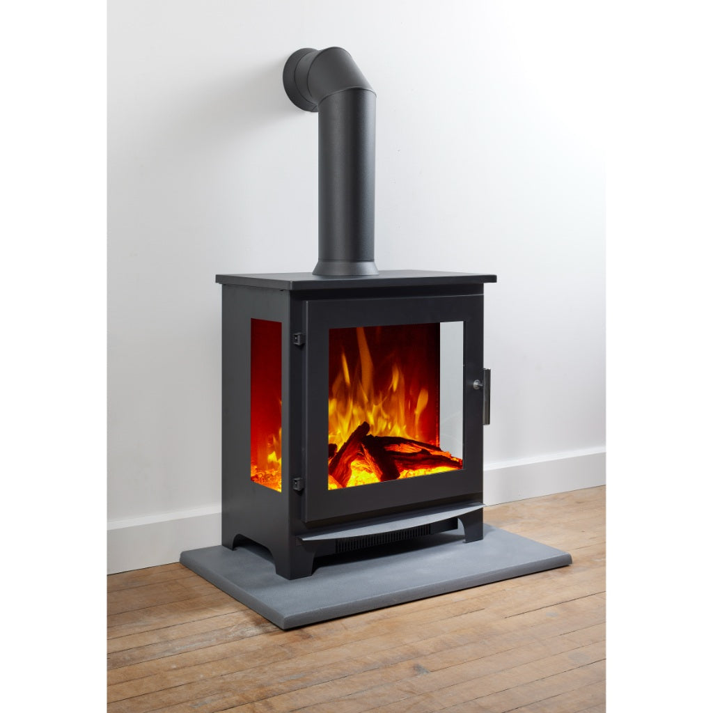 Flametek Trio 3-Sided Electric stove in black with a realistic log flame effect, standing on a grey hearth.