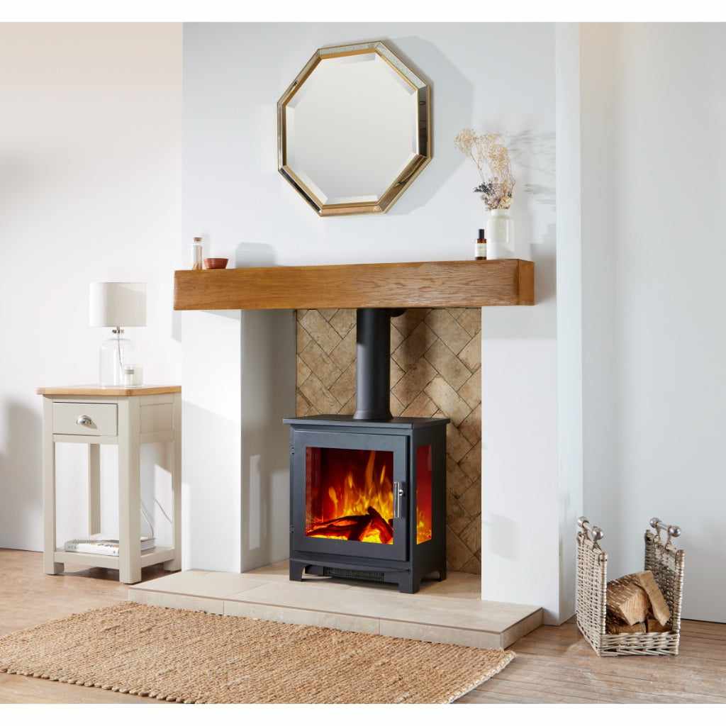Flametek Trio 3-Sided Electric stove in black with a realistic flame effect, set in a fireplace with a wooden mantel.