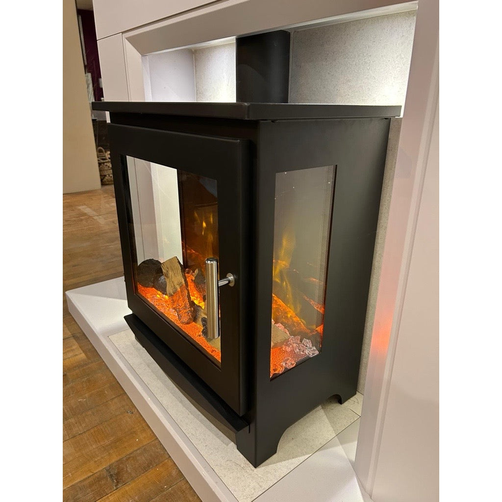 Flametek Trio 3-Sided Electric stove with a black metal frame, glass side panels, and glowing log fire effect.