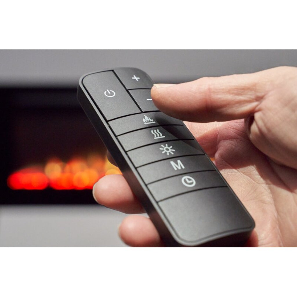 Hand holding a black remote control for an Orlando 50 Inch Media Wall Electric Fire with flame and heat icons.