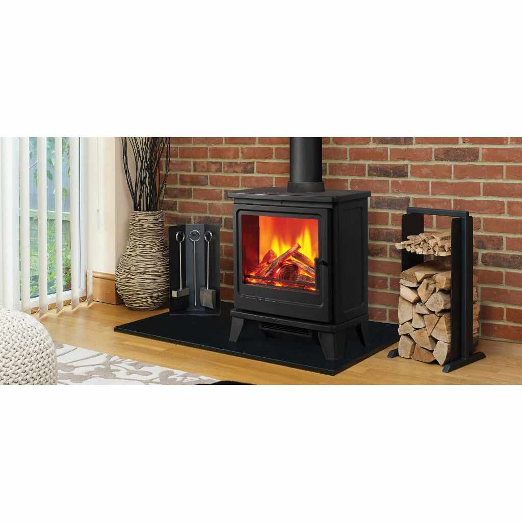 Solution Fires Blackthorn electric stove in black with a realistic flame effect, set on a hearth against a brick wall.