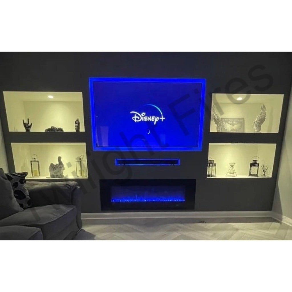 Aurora 50 Inch Media Wall Electric Fire Insert with blue flame effect, set in a dark grey wall with illuminated alcoves.