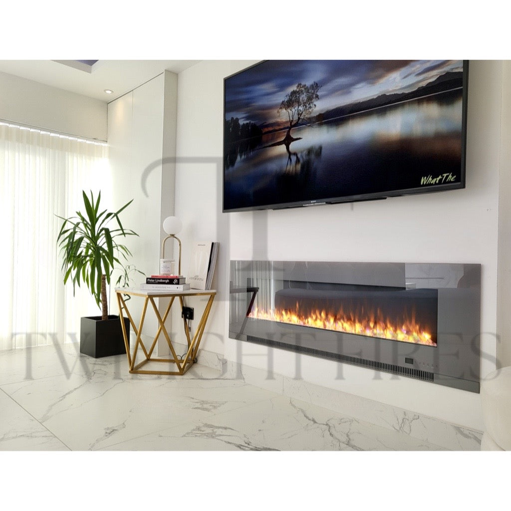 Aurora 72 Inch Media Wall Electric Fire Insert with a sleek black glass finish and glowing flames in a modern room.