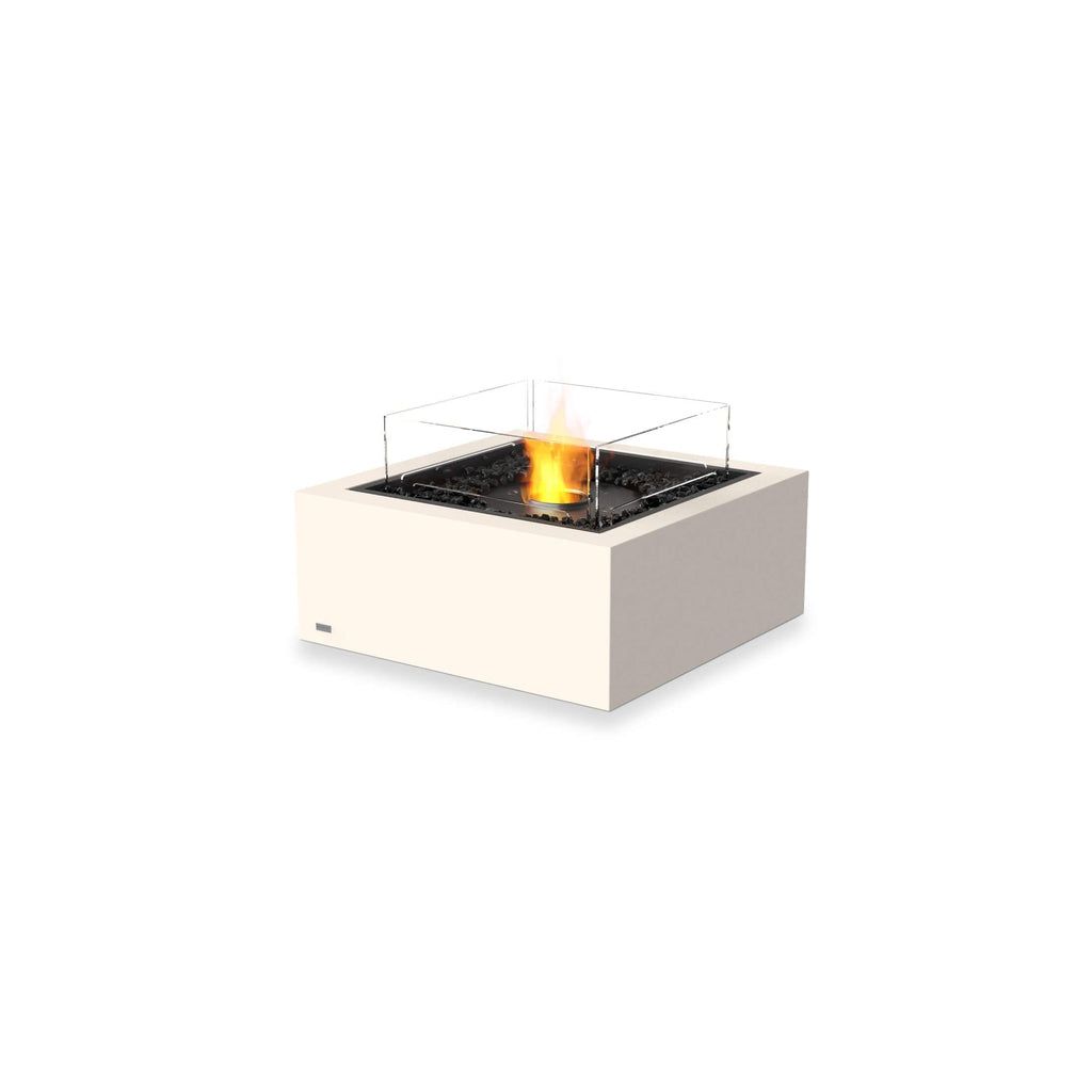 EcoSmart Fire Base 30 bioethanol fire pit table in cream with a glass screen and black decorative stones.