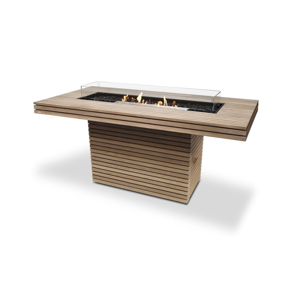 EcoSmart Fire Gin 90 bar table with slatted teak wood finish, central bioethanol burner, and glass wind screen.