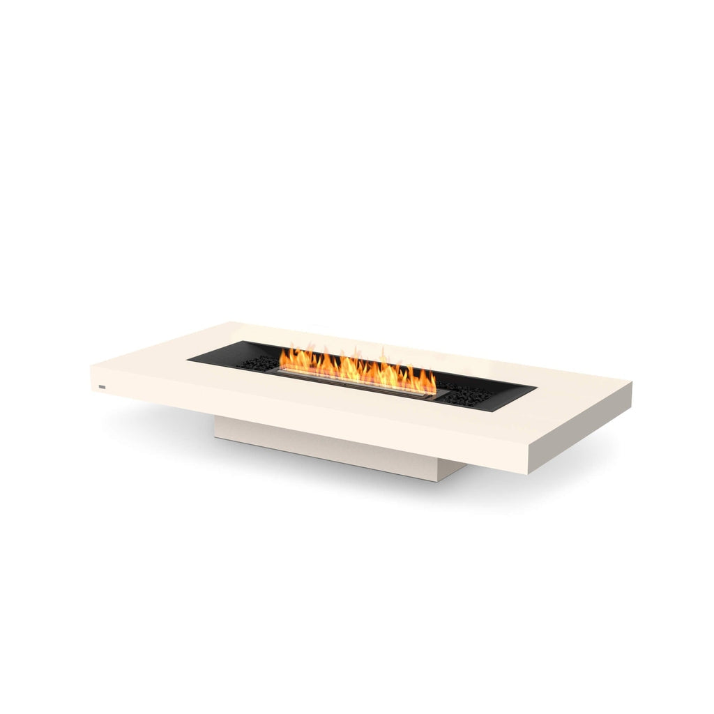 EcoSmart Fire Gin 90 low bioethanol fire pit table in cream with a central black burner and orange flames.