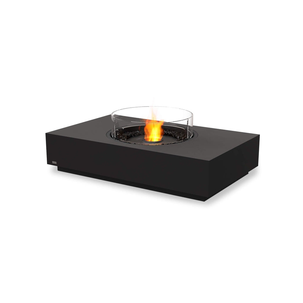 EcoSmart Fire Martini 50 bioethanol fire pit table in matte black with a central glass screen and glowing orange flame.