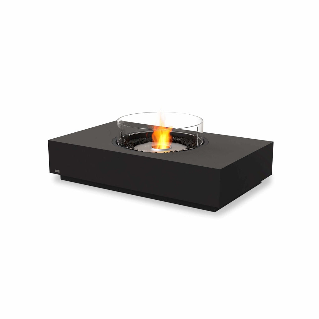 EcoSmart Fire Martini 50 bioethanol fire pit table in black with a central glass screen and glowing orange flame.