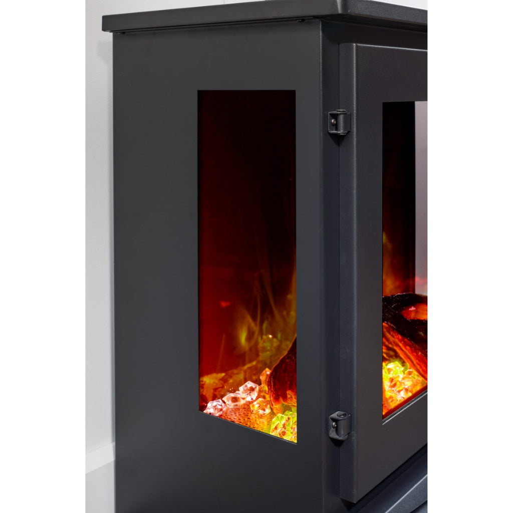 Close-up of a black Firetti New York Electric Stove Suite with glass side panels showing glowing embers and flames.