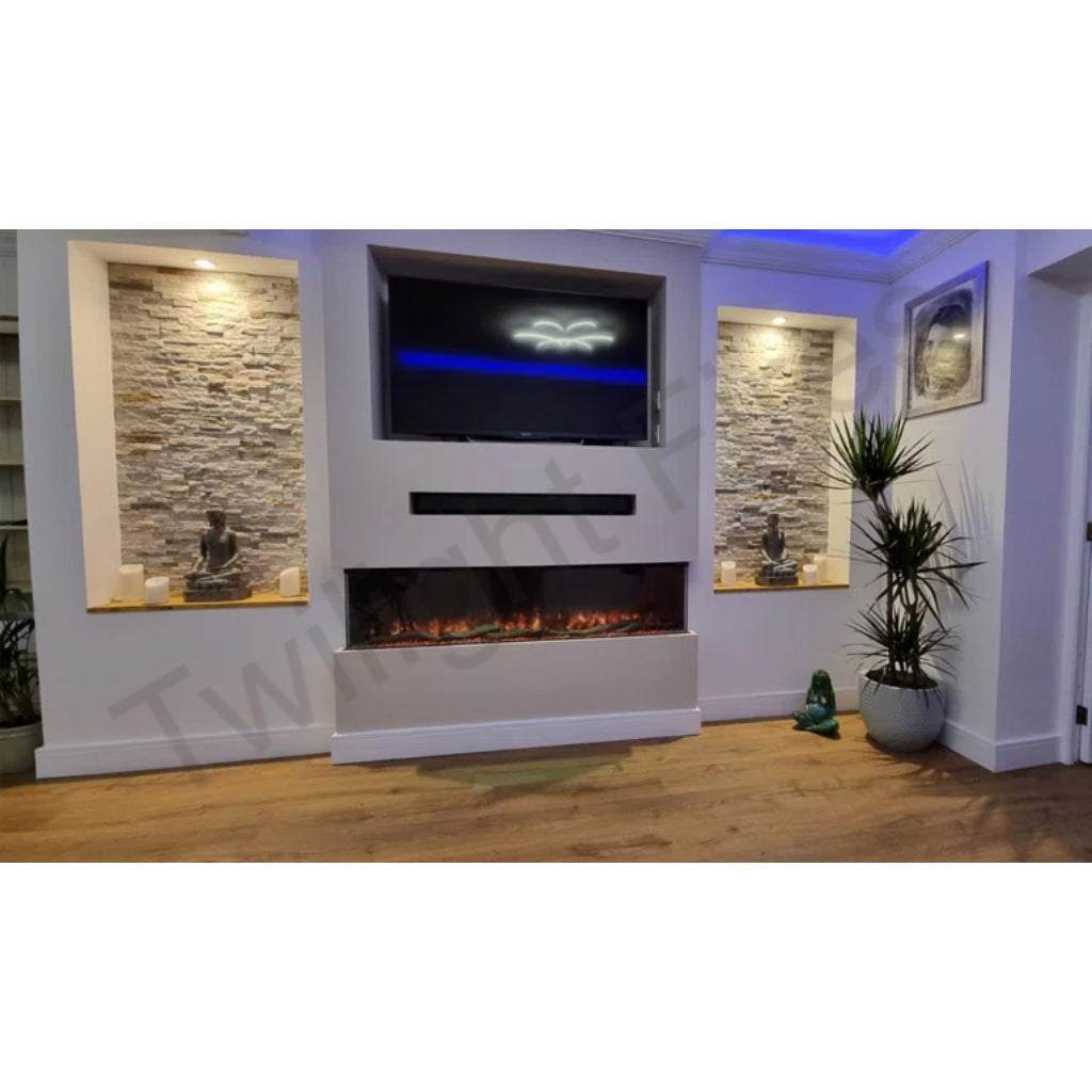 Luvelle 50” 3D Panoramic Media Wall Electric Fire set into a white chimney breast with stone-effect alcoves.