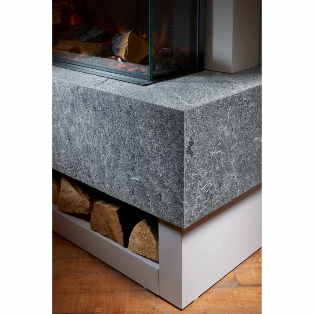 OER Vancouver Electric Fireplace Suite with a grey stone-effect hearth and log storage shelf.