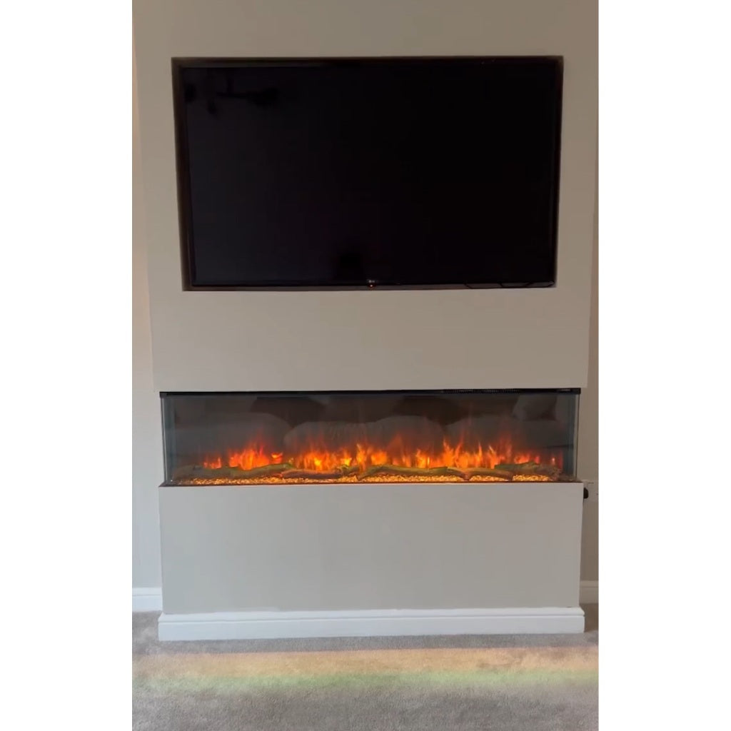 Slimline panoramic 3D electric fire with orange flames and log effect, installed in a cream media wall below a TV.
