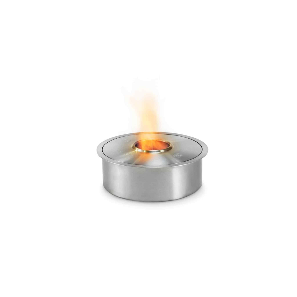 EcoSmart Fire AB3 ethanol burner in brushed stainless steel with a small, flickering orange flame.