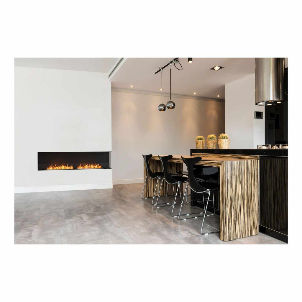 EcoSmart Fire Flex 104 bioethanol fireplace insert installed in a white wall next to a modern kitchen breakfast bar.