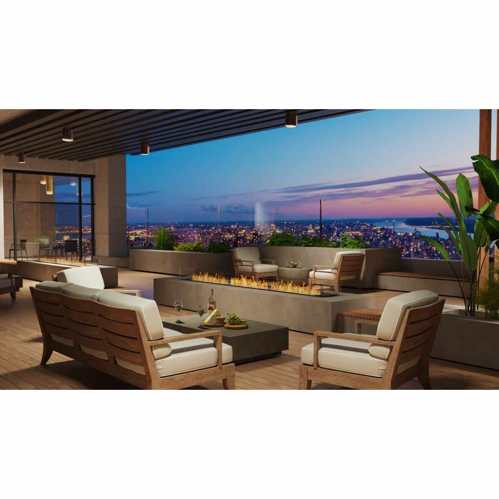 EcoSmart Fire Flex 18 bioethanol fireplace insert set in a grey concrete hearth on a modern outdoor terrace.