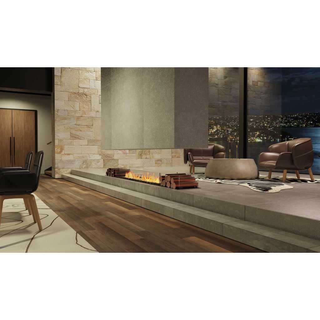 EcoSmart Fire Flex 42 bioethanol fireplace insert with a long, linear flame set into a raised grey stone hearth.