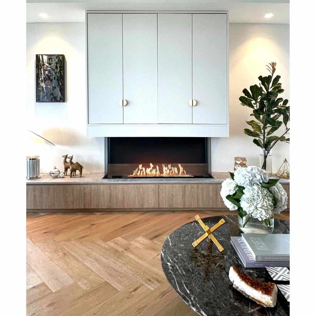 EcoSmart Fire Flex 50 bioethanol fireplace with a black frame set into a light wood and white cabinetry wall.