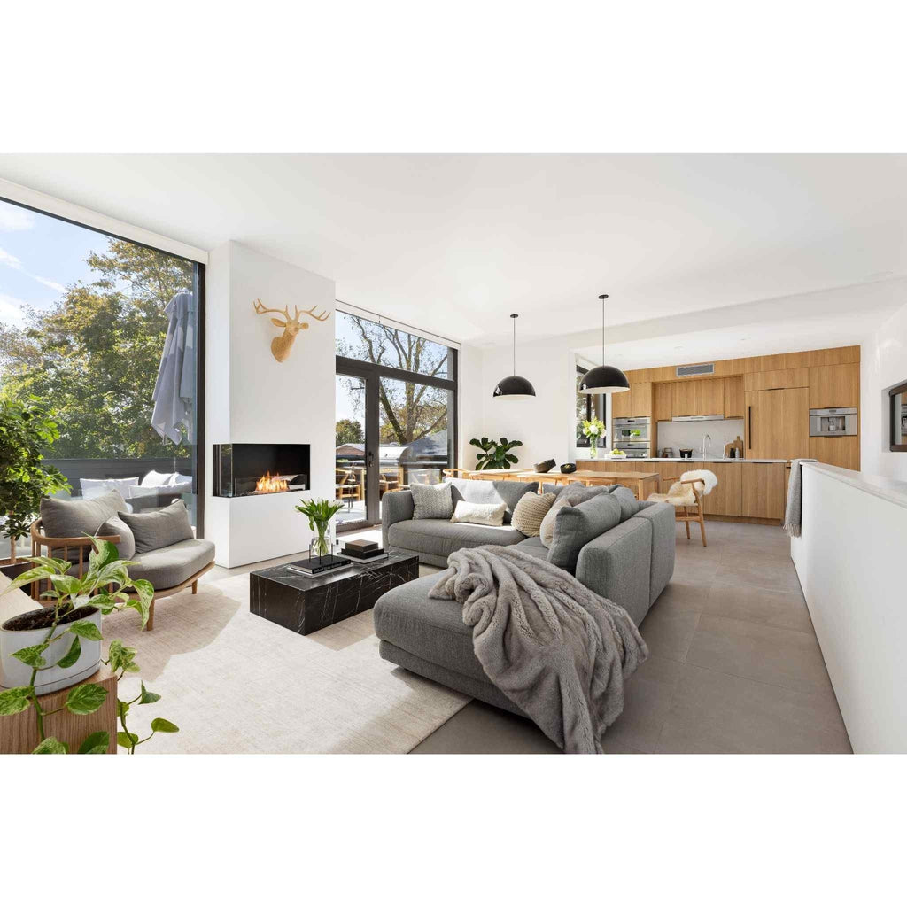 EcoSmart Fire Flex 50 bioethanol fireplace insert installed in a white wall within a modern open-plan living room.