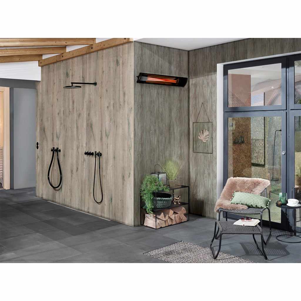 Heatscope Heaters Pure 2400W electric radiant heater mounted on a wood-effect wall in a modern room.