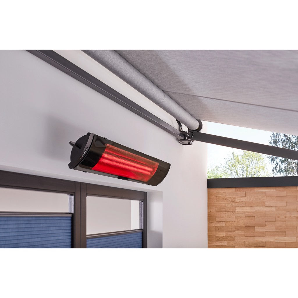 Heatscope Heaters Pure 3000W electric radiant heater mounted on a white wall with a glowing red heating element.