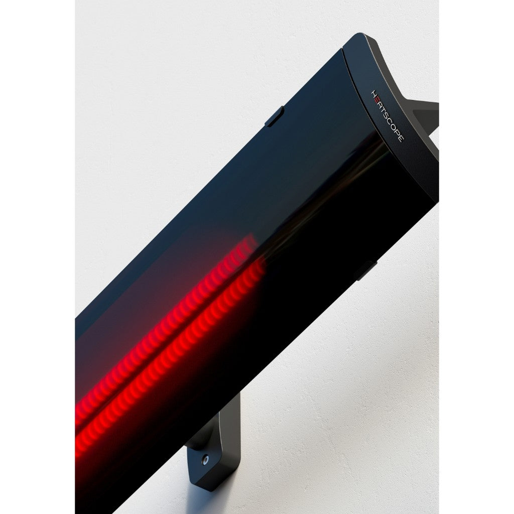 Heatscope Heaters Pure 3000W electric radiant heater in black, mounted on a white wall with glowing red heating elements.