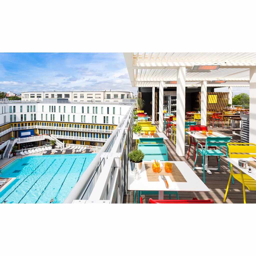 Heatscope Heaters Spot 2800W electric radiant heater mounted on a white pergola above a colourful outdoor terrace.