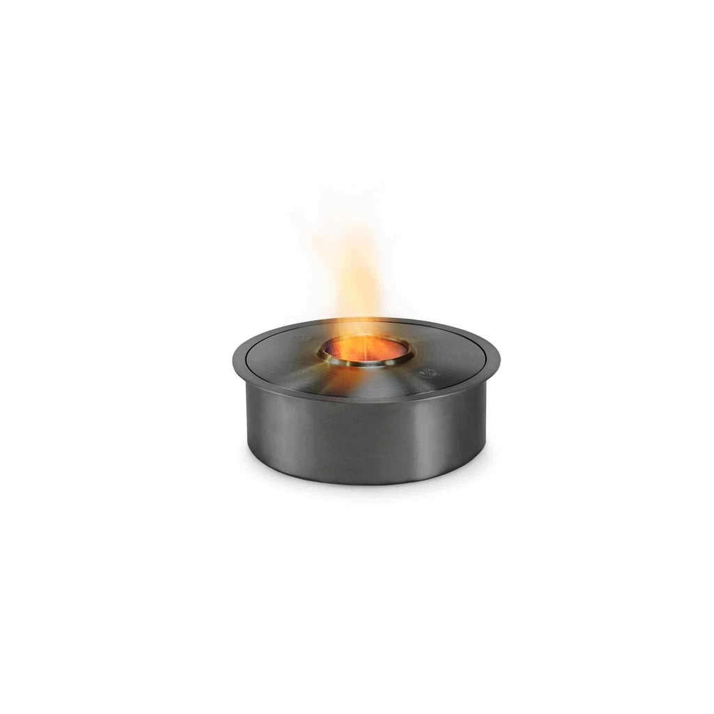 EcoSmart Fire AB8 ethanol burner in a brushed stainless steel finish with a small orange flame against a white background.