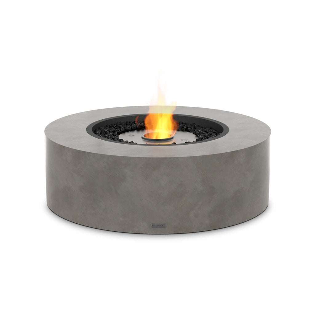 EcoSmart Fire Ark 40 bioethanol fire pit table in grey concrete with a central flame and black decorative stones.