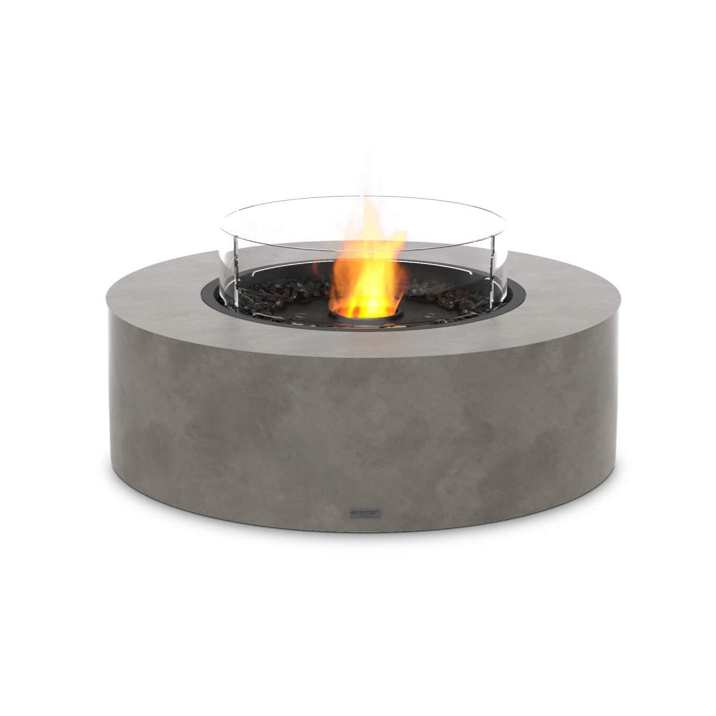 EcoSmart Fire Ark 40 bioethanol fire pit table in grey concrete with a circular glass screen and central flame.