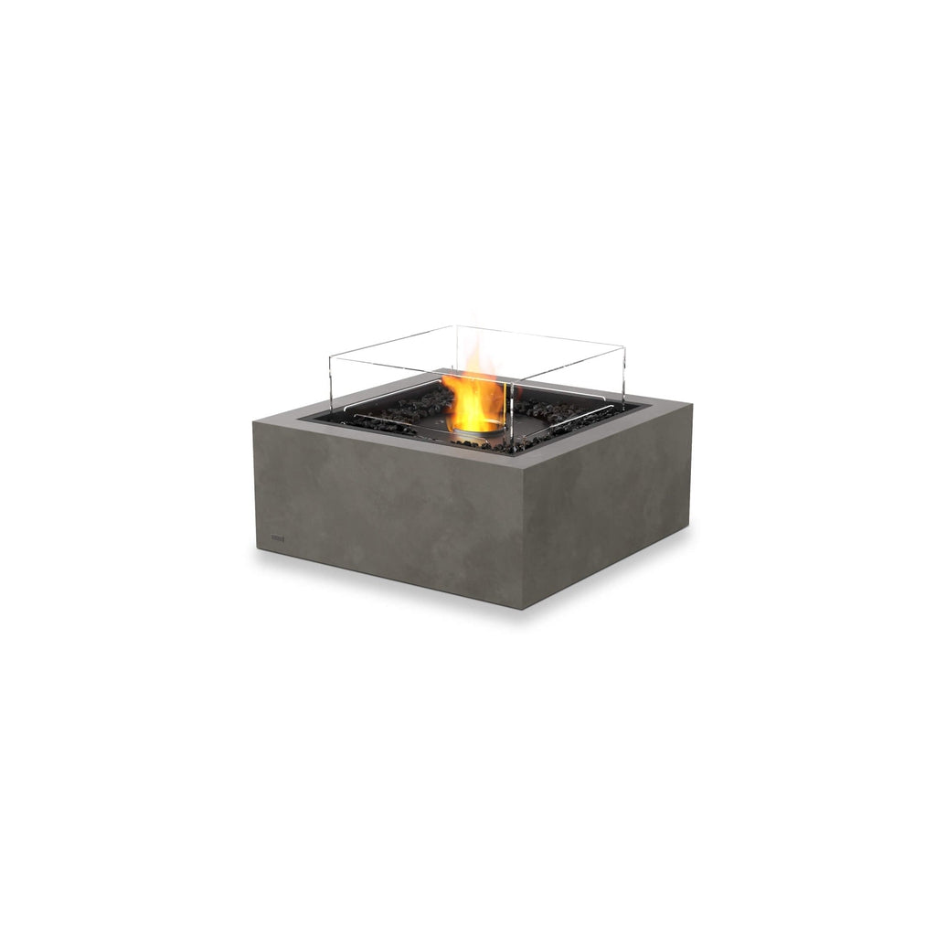 EcoSmart Fire Base 30 bioethanol fire pit in grey concrete with a square glass screen and central flame.