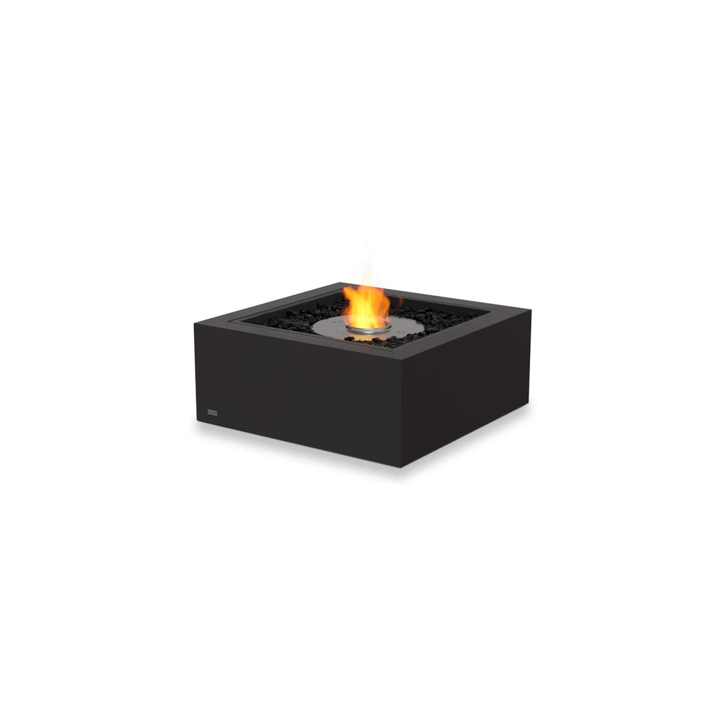 EcoSmart Fire Base 30 square black bioethanol fire pit with a central flame and decorative black lava rocks.