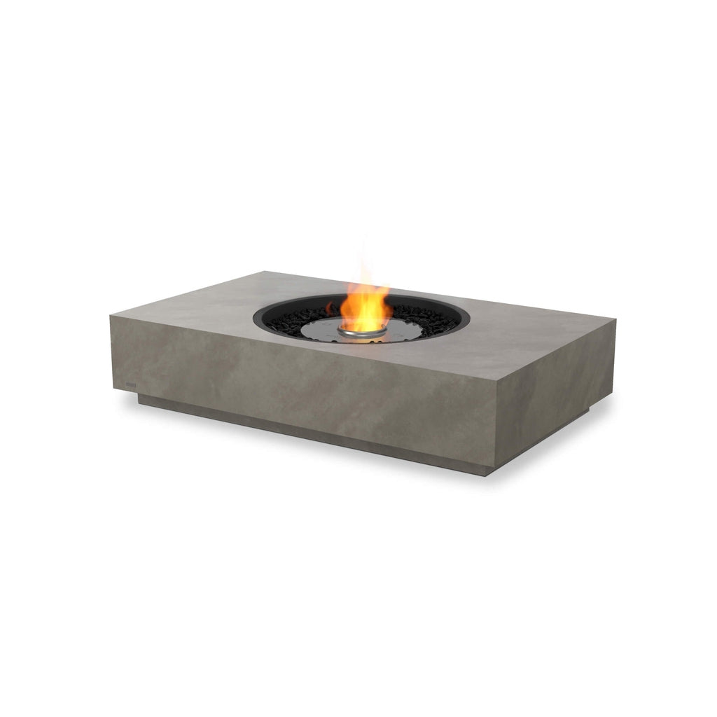 EcoSmart Fire Martini 50 bioethanol fire pit table in grey concrete with a central flame and black decorative stones.