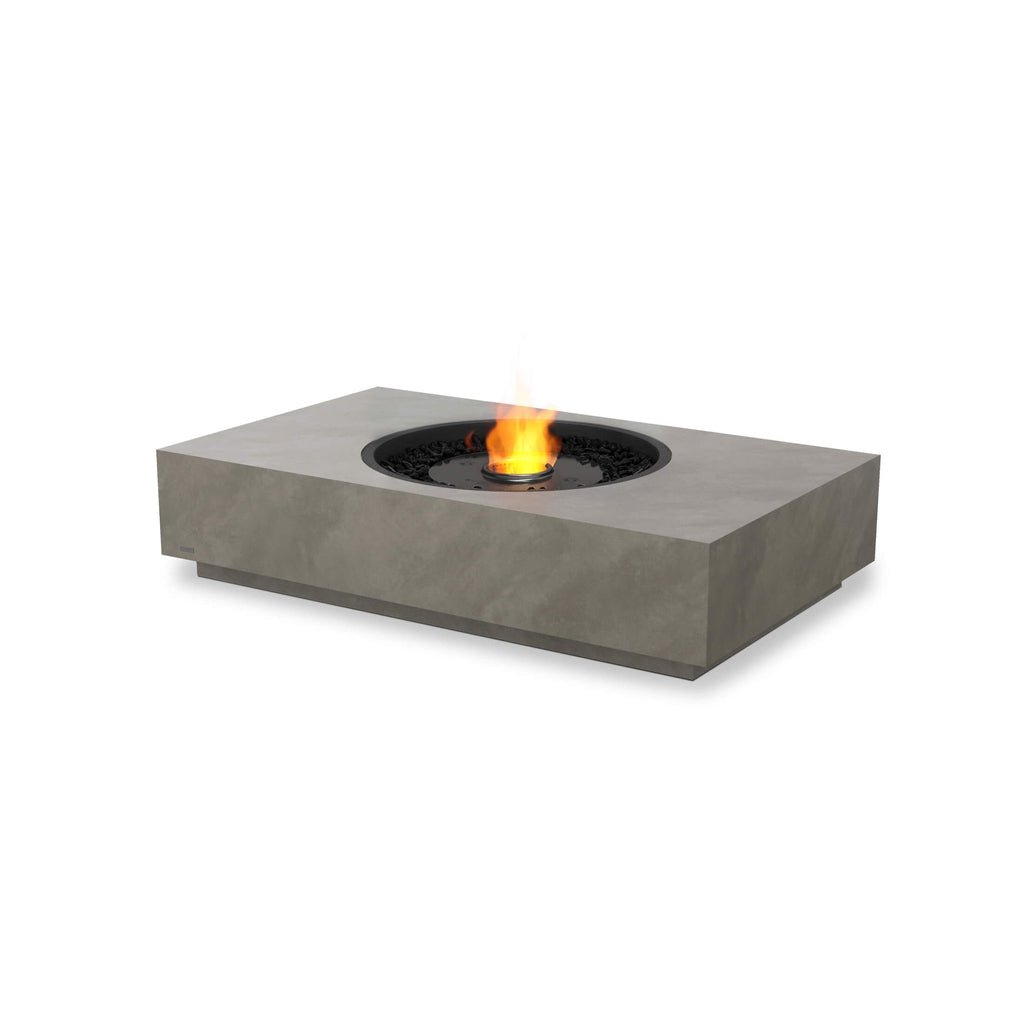 EcoSmart Fire Martini 50 rectangular grey concrete fire pit table with a central flame and black decorative stones.