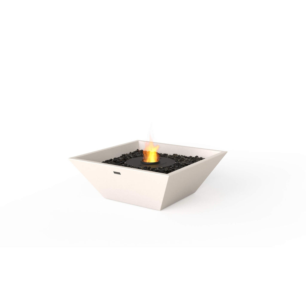 EcoSmart Fire Nova 600 bioethanol fire pit bowl in off-white with black decorative stones and a central flame.