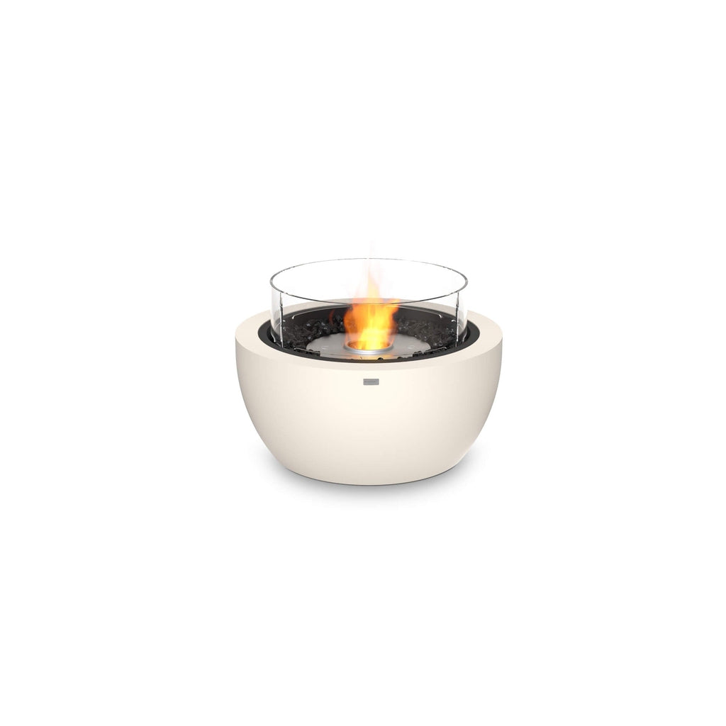 EcoSmart Fire Pod 30 bioethanol fire pit in cream with a circular glass screen and black decorative stones.
