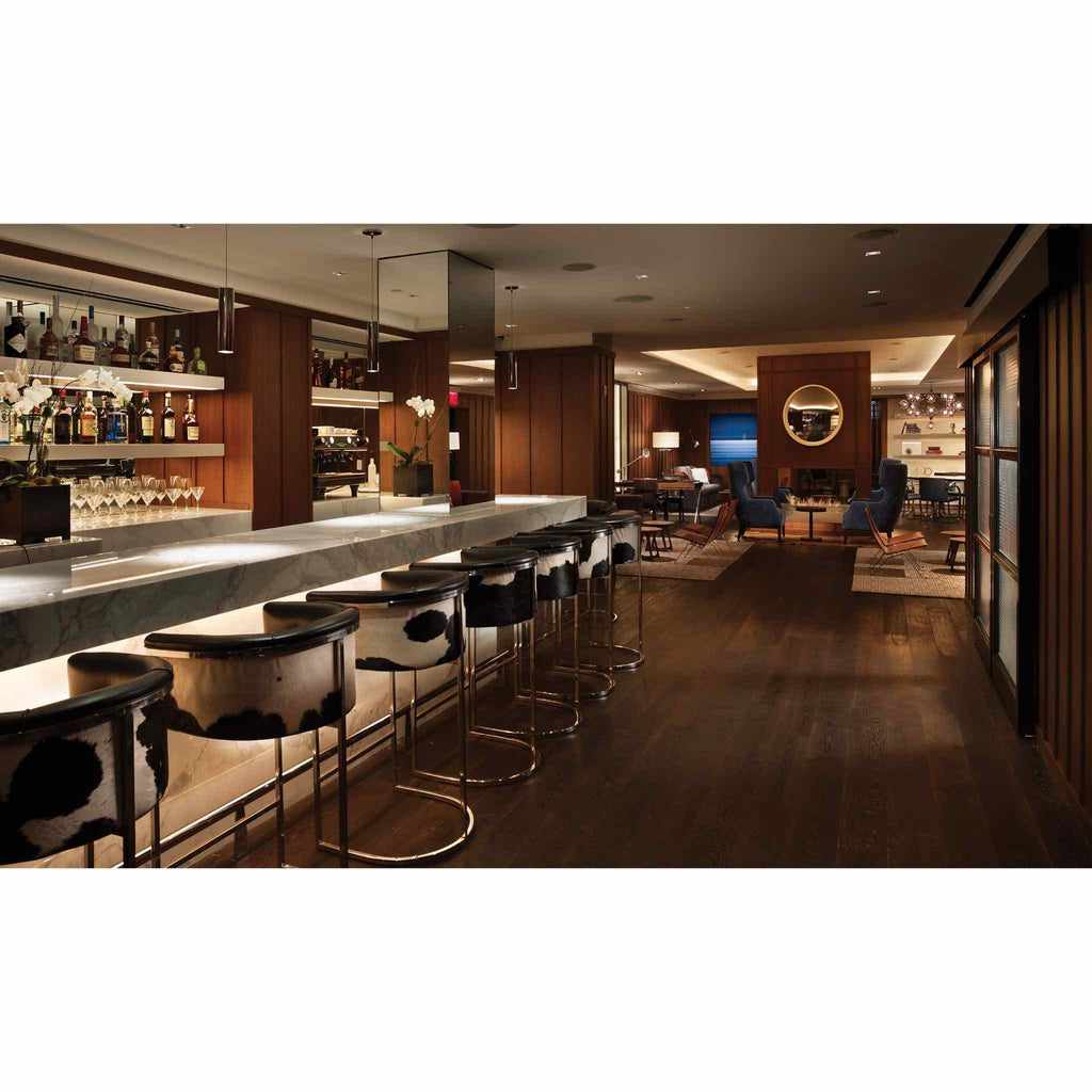 EcoSmart Fire XL700 Ethanol Burner integrated into a modern bar counter in a sophisticated lounge setting.