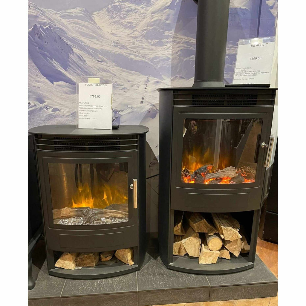 Flametek Alto S 2Kw electric stove in black steel with a glass door, glowing log flame effect, and log storage base.