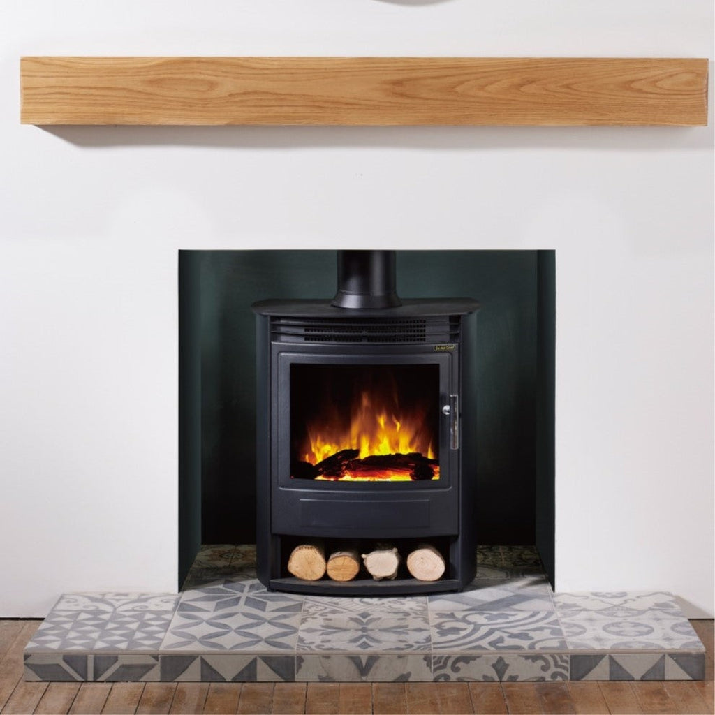 Flametek Alto S 2Kw electric stove in black with a log storage base, glowing flame effect, and patterned tiled hearth.
