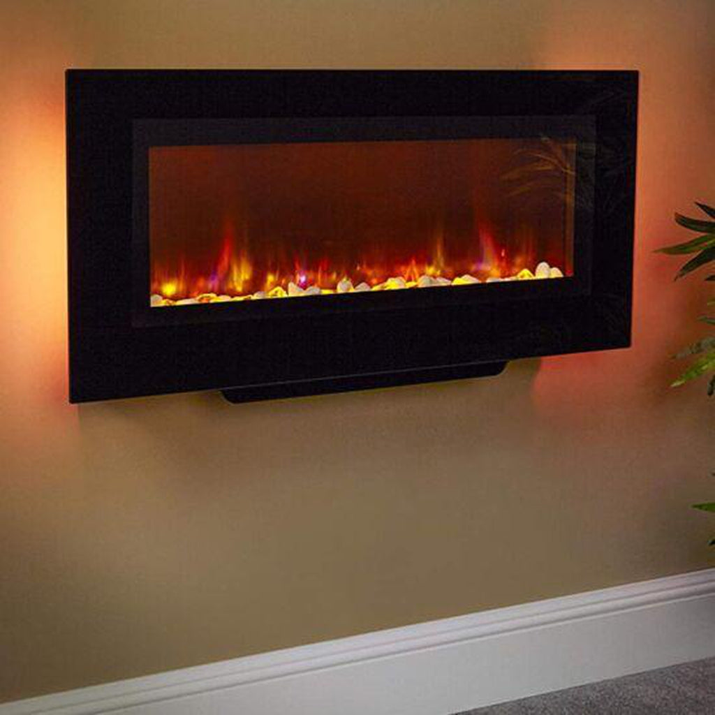 Suncrest Santos wall mounted electric fireplace with a black frame, glowing pebble fuel bed and warm LED backlighting.