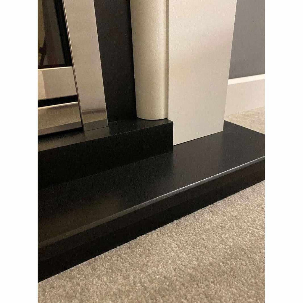 Suncrest Talent Electric Fireplace Suite with a matte black hearth, white surround, and silver metallic fire trim.